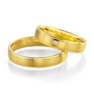 Geelgouden sierlijke trouwringen Geelgouden sierlijke trouwringen