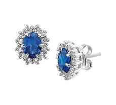 Gerhodineerd zilveren oorknoppen met een rozet van saffier en zirkonia Gerhodineerd zilveren oorknoppen met een rozet van saffier en zirkonia