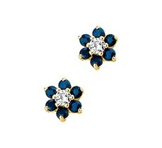Geelgouden oorknoppen met saffier en zirkonia. Geelgouden oorknoppen met saffier en zirkonia.